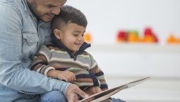 Dad reading to child